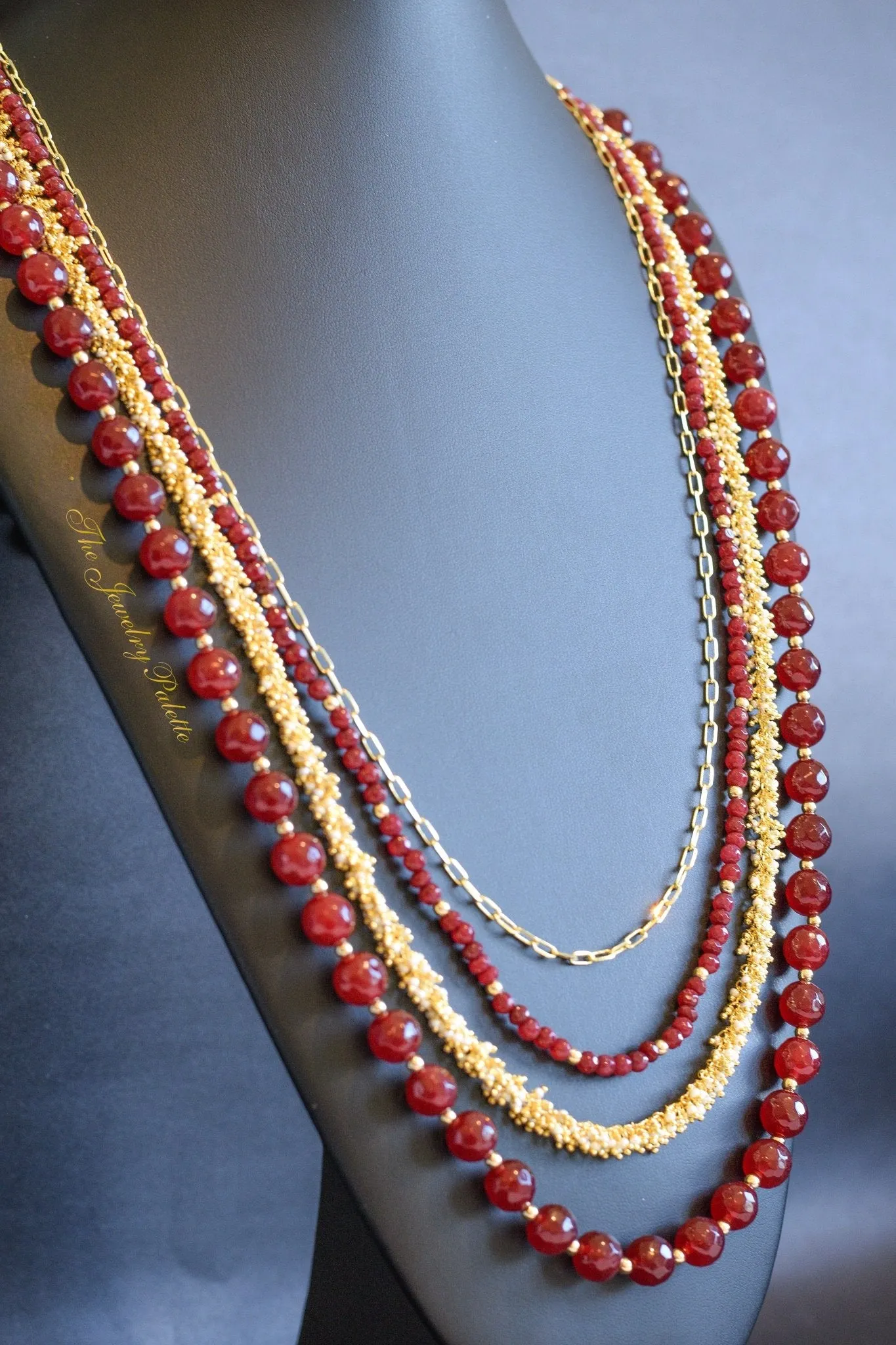 Irene luxurious maroon and gold four tier necklace