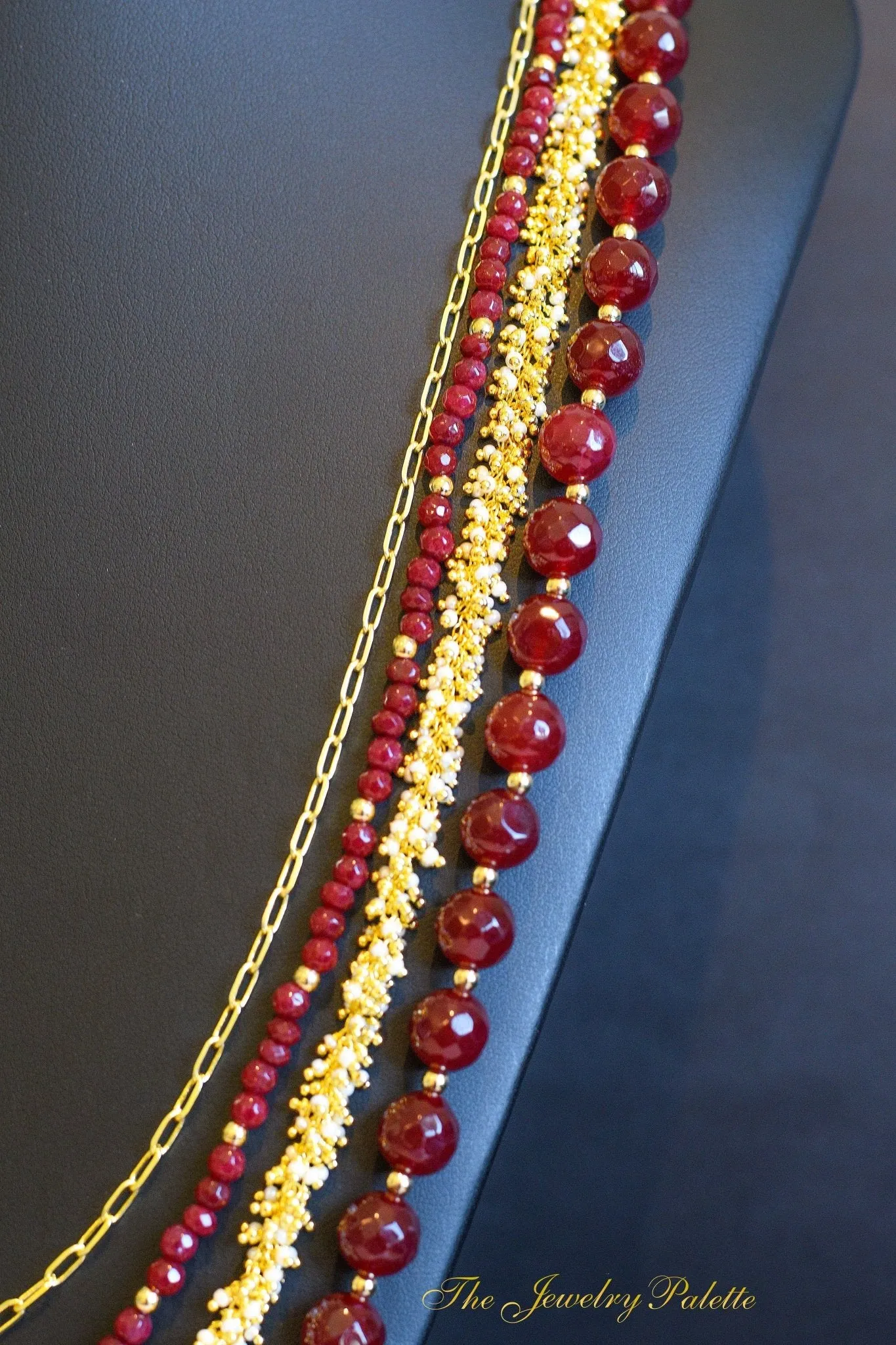 Irene luxurious maroon and gold four tier necklace
